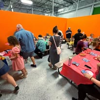 Birthday party guests gathered in a party room at Arena 5/9