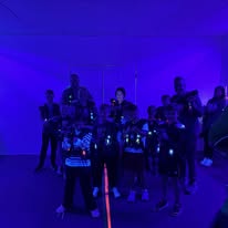 Family and friends getting ready to play laser tag at Arena 5/9