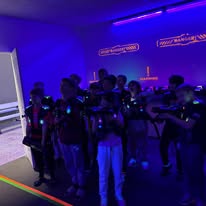 Kids playing laser tag together at Arena 5/9